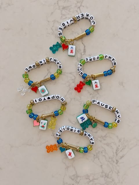 Collection of mahjong-themed hooks with colorful gummy bear and tile charms
