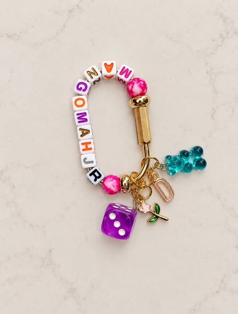 Colorful mahjong letter-bead hook with purple dice and teal gummy bear charms